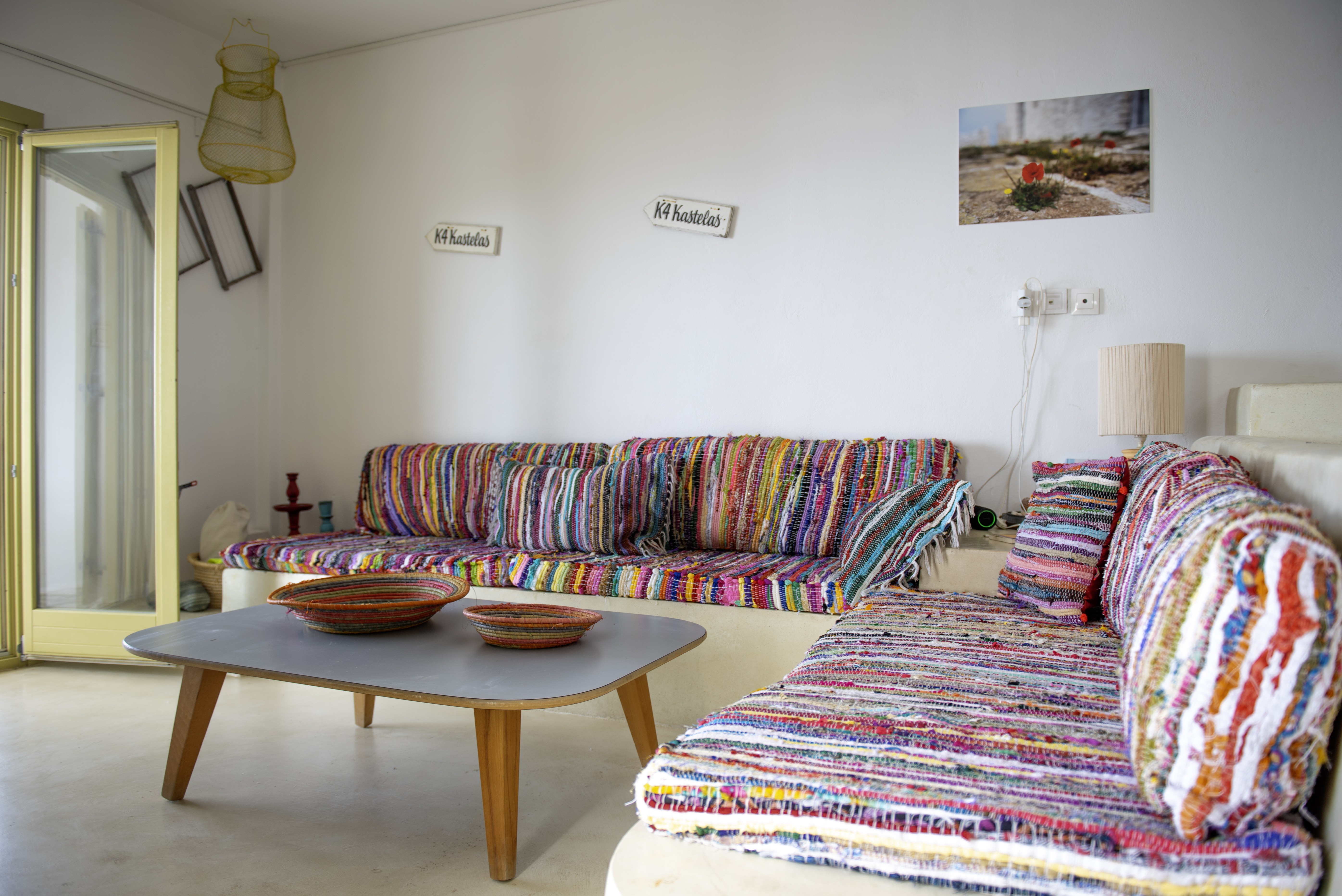 The Maisonette living room with colourful Cycladic textiles