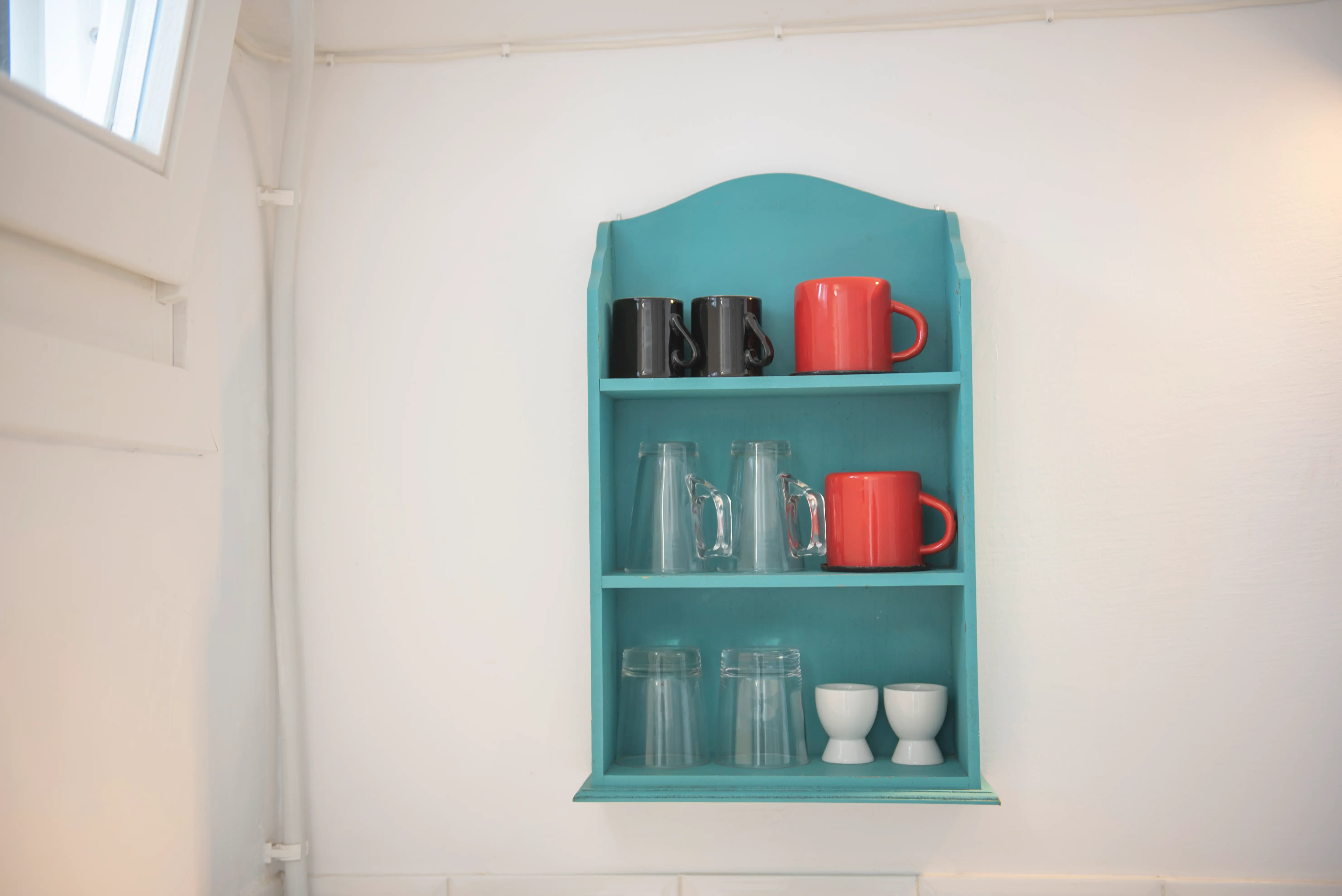 Teal shelf with cups and glasses, The Studio