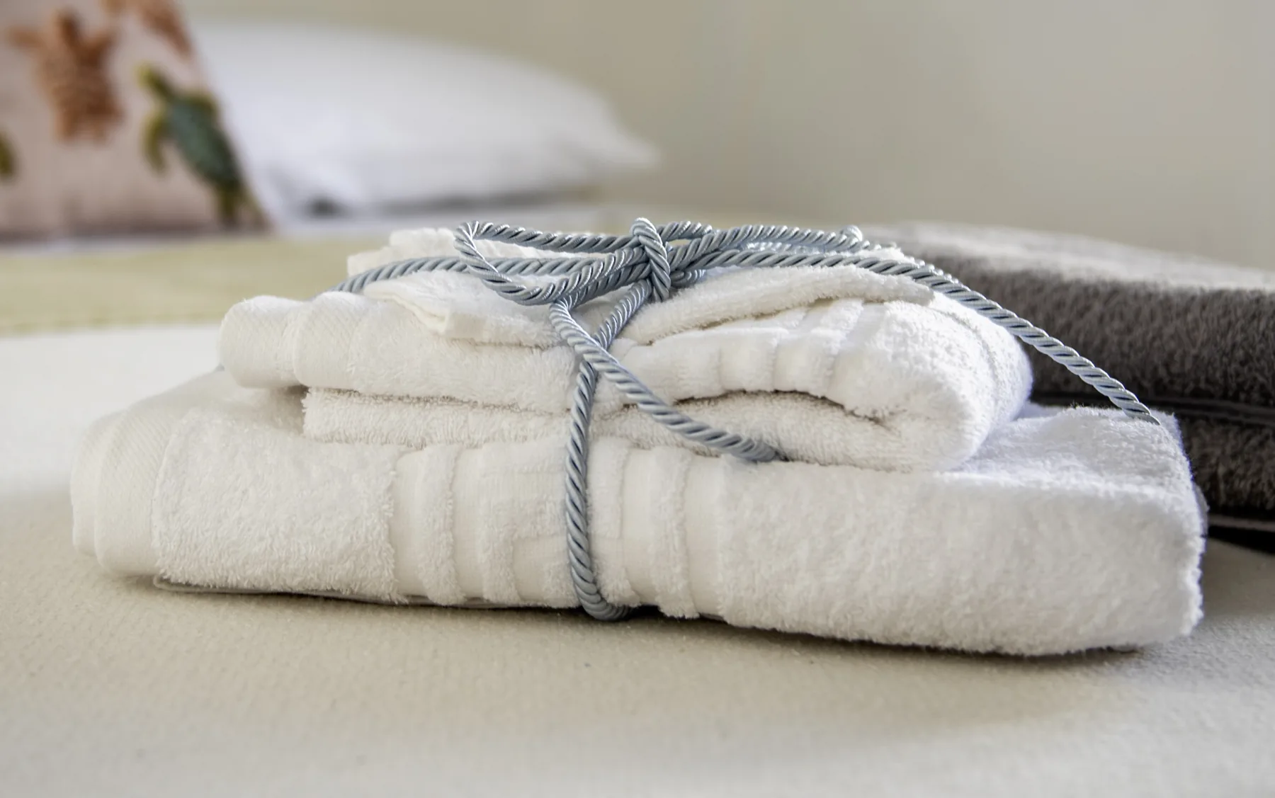 Fresh towels tied with a blue cord, The Maisonette